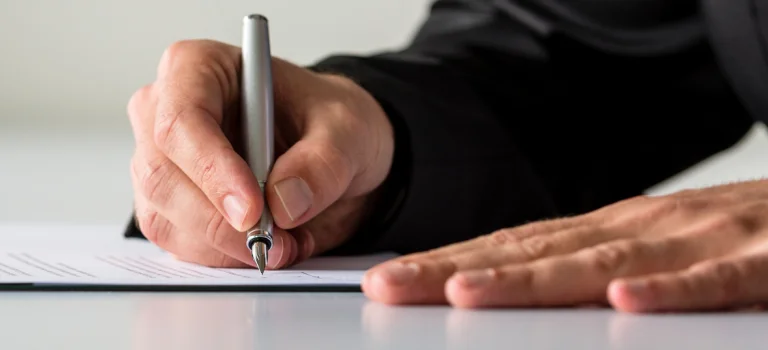 a pen on a piece of paper
