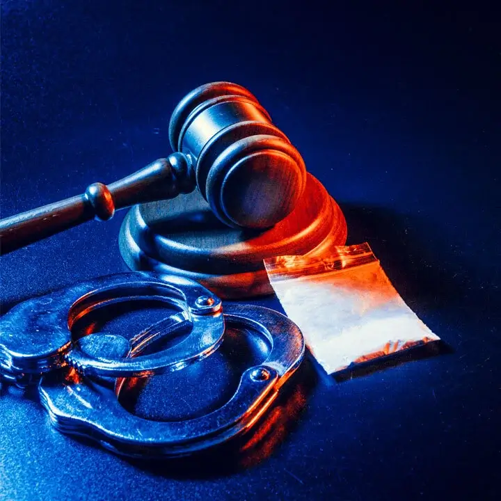 court gavel, handcuffs and drugs