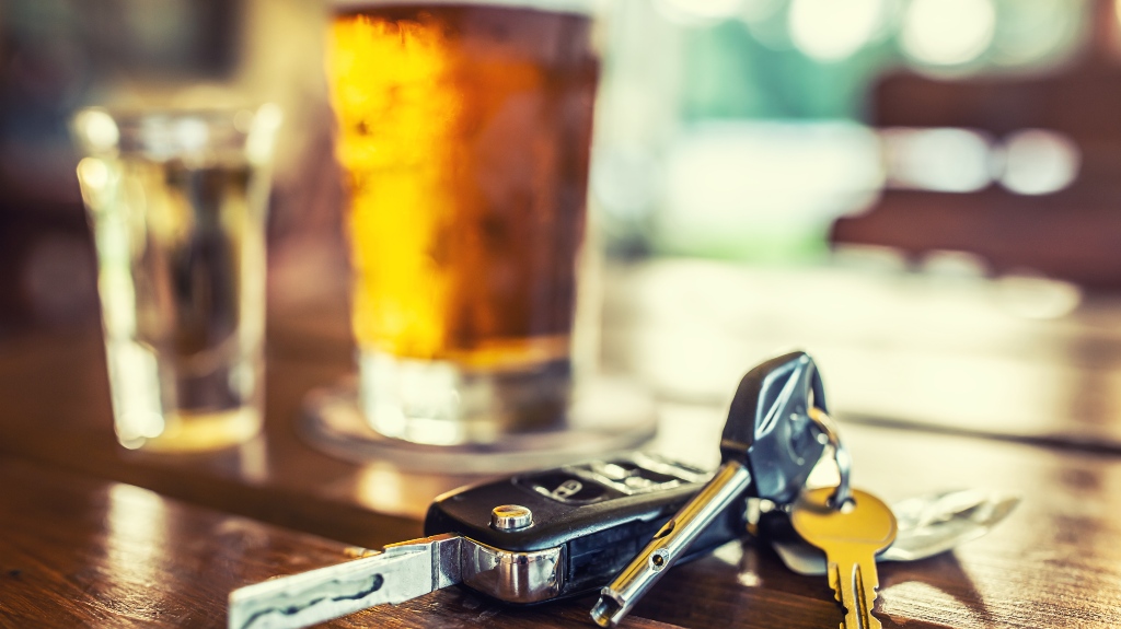 Car keys and glass of beer