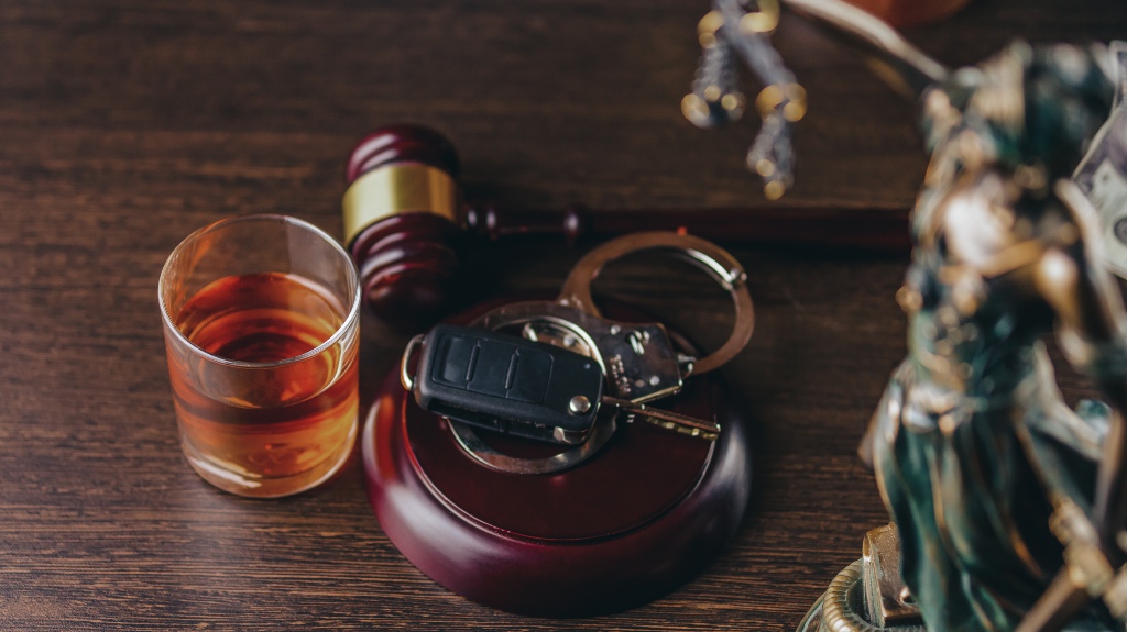 Whiskey with car keys and handcuffs