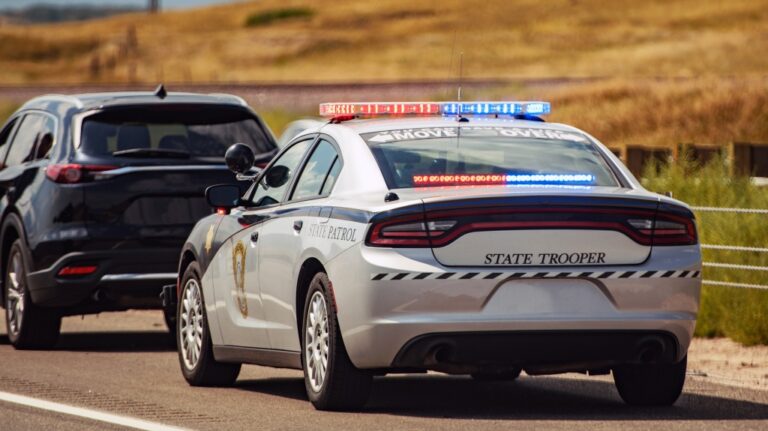 Highway state trooper pulling over vehicle