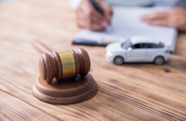 lawyer is working with documents, toy car and judge's gavel
